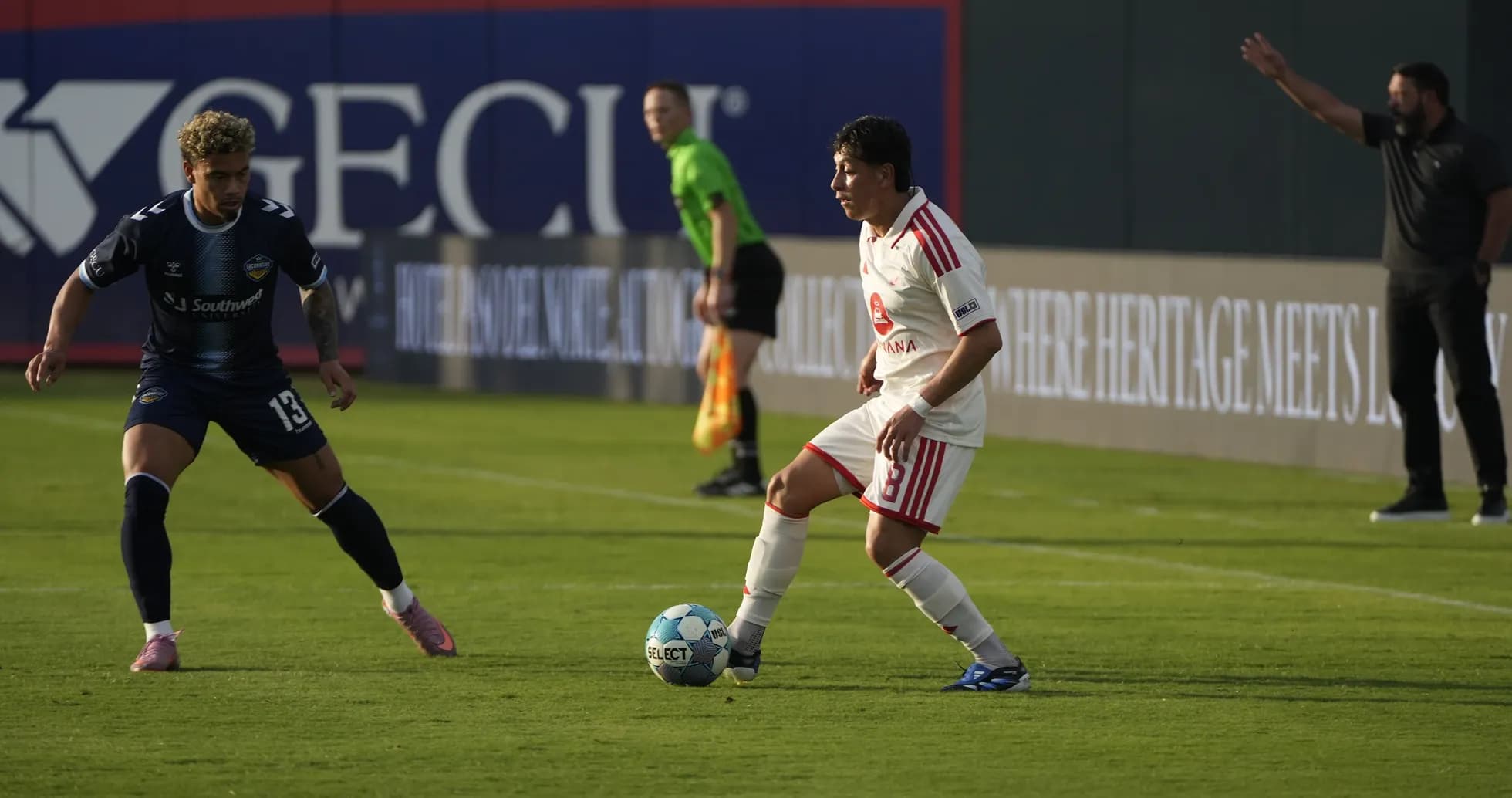 Players competing for the ball during match