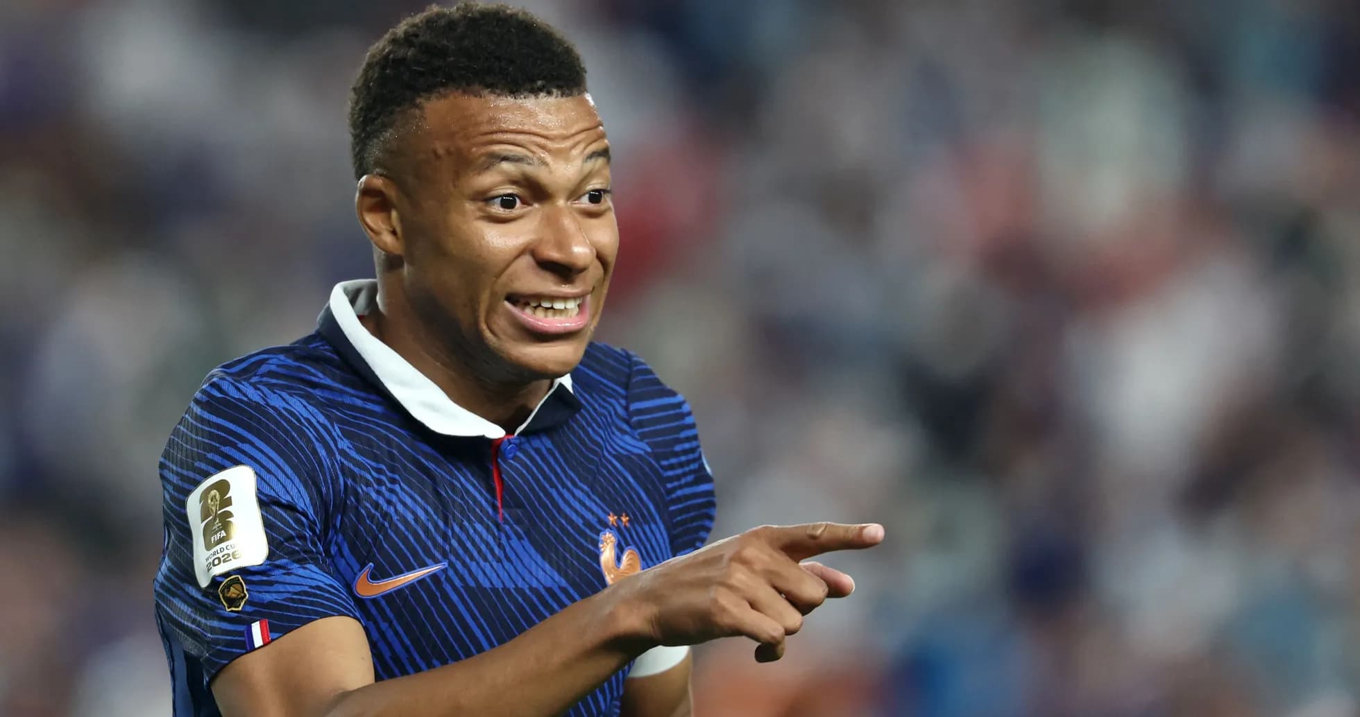 Kylian Mbappé celebrating during a match