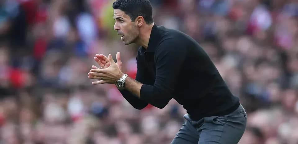 Coach gesturing during a match on the sidelines