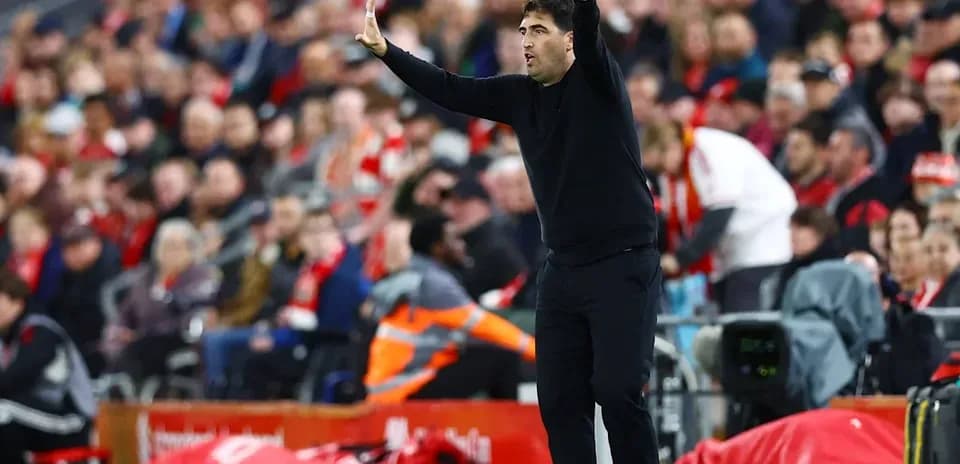 Coach gesturing during a match on the sideline