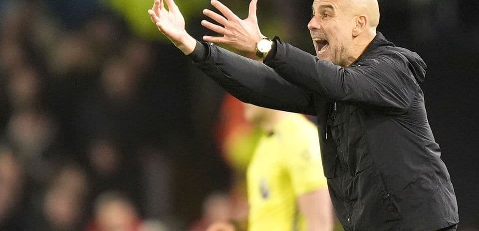Manager gesturing passionately from the sidelines