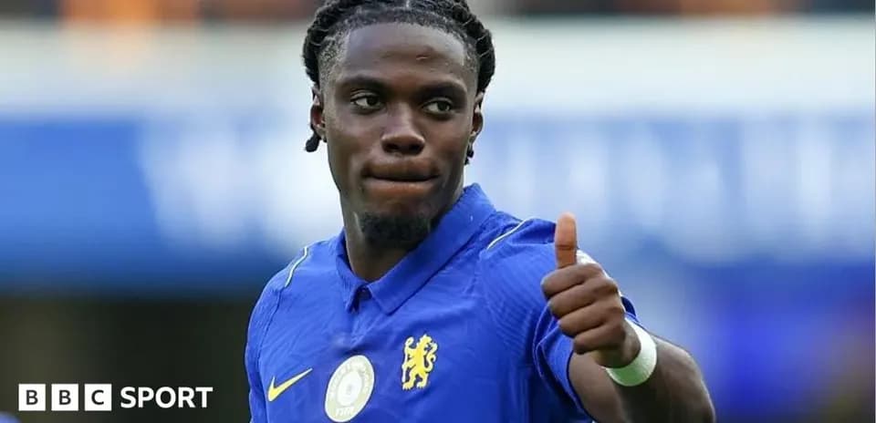 Player giving a thumbs-up during match celebration