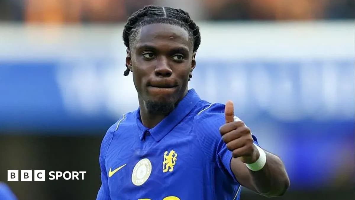 Player giving a thumbs-up during match celebration