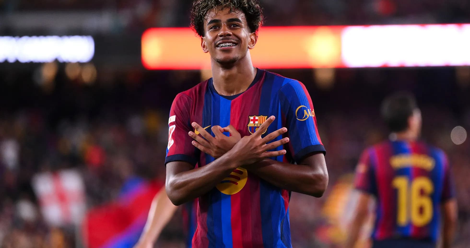Player celebrating goal with crossed arms gesture