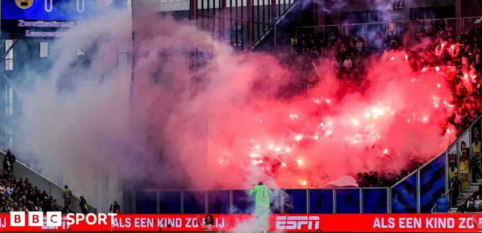 Fans using flares during a football match