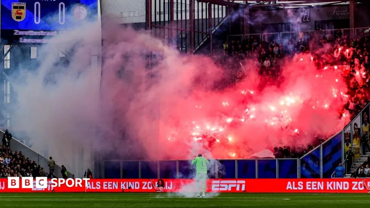 Fans using flares during a football match