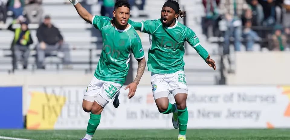 Players celebrating a goal during match