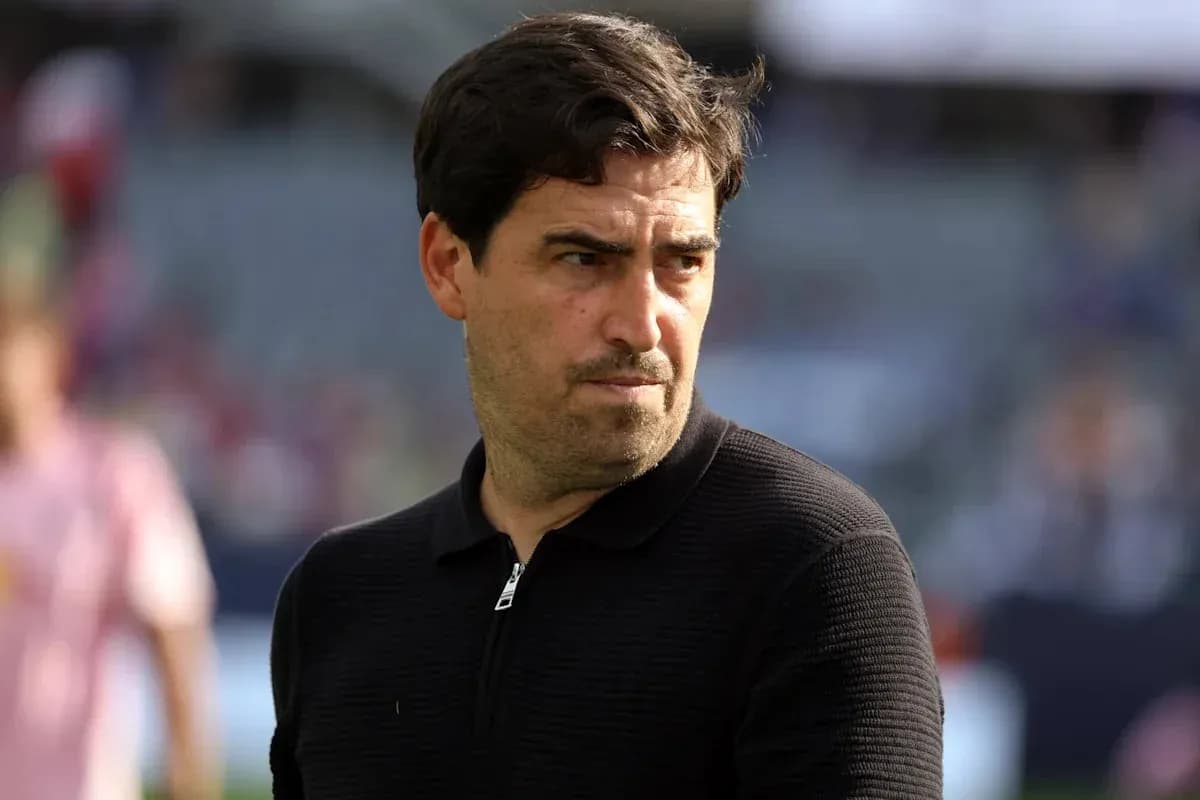 Coach observing players during warm-up on field