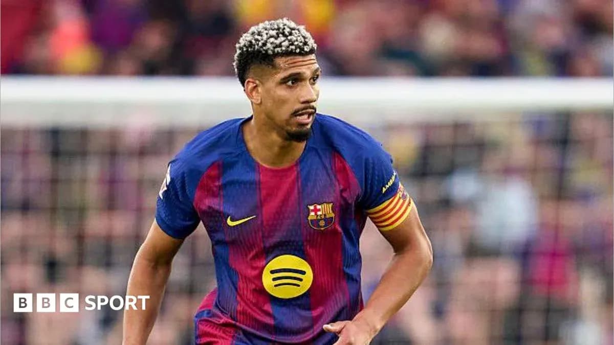 Player in Barcelona jersey running on the field