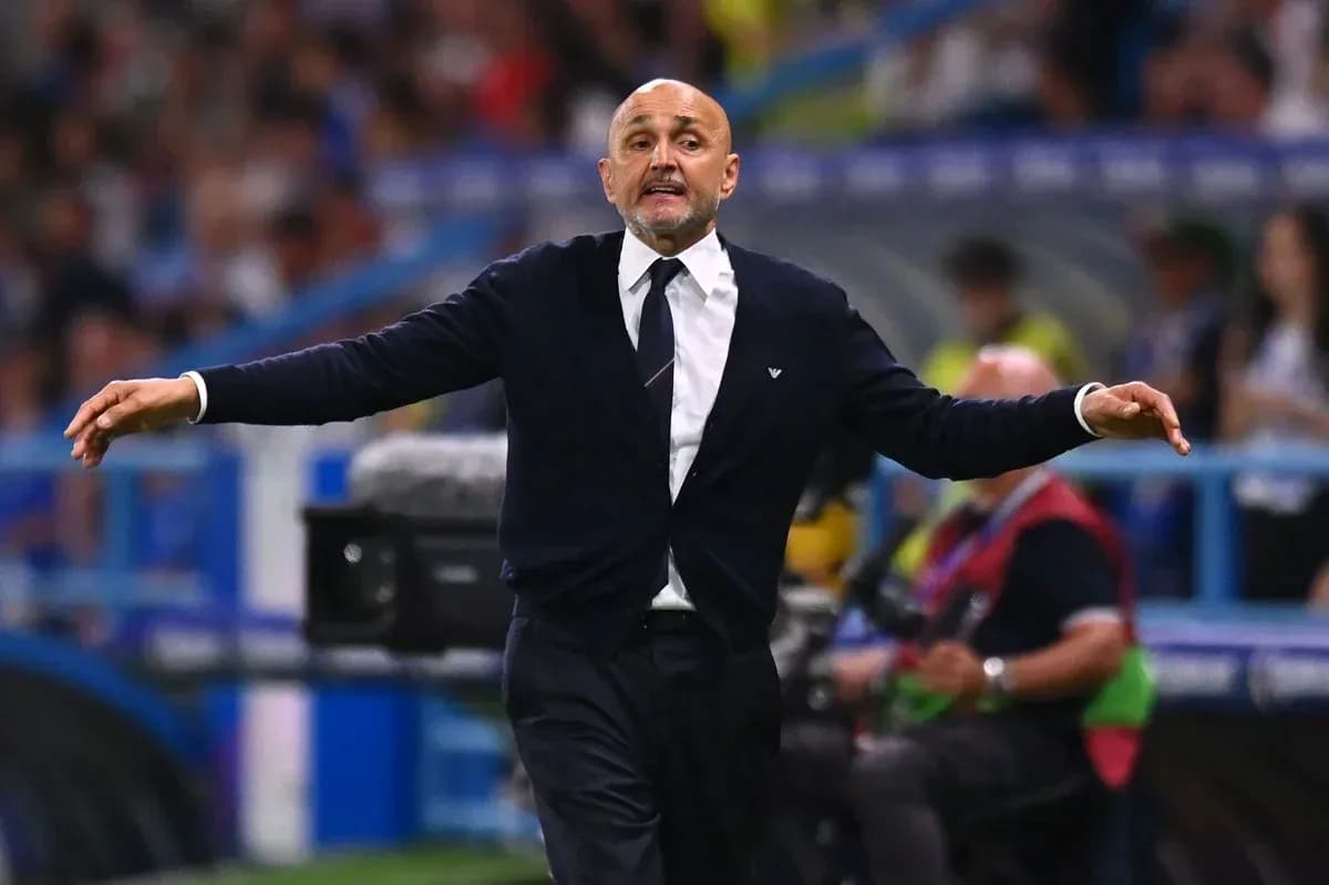 Coach gesturing on the sidelines during match