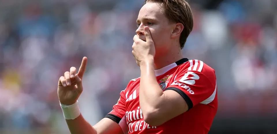 Player celebrating a goal with raised finger