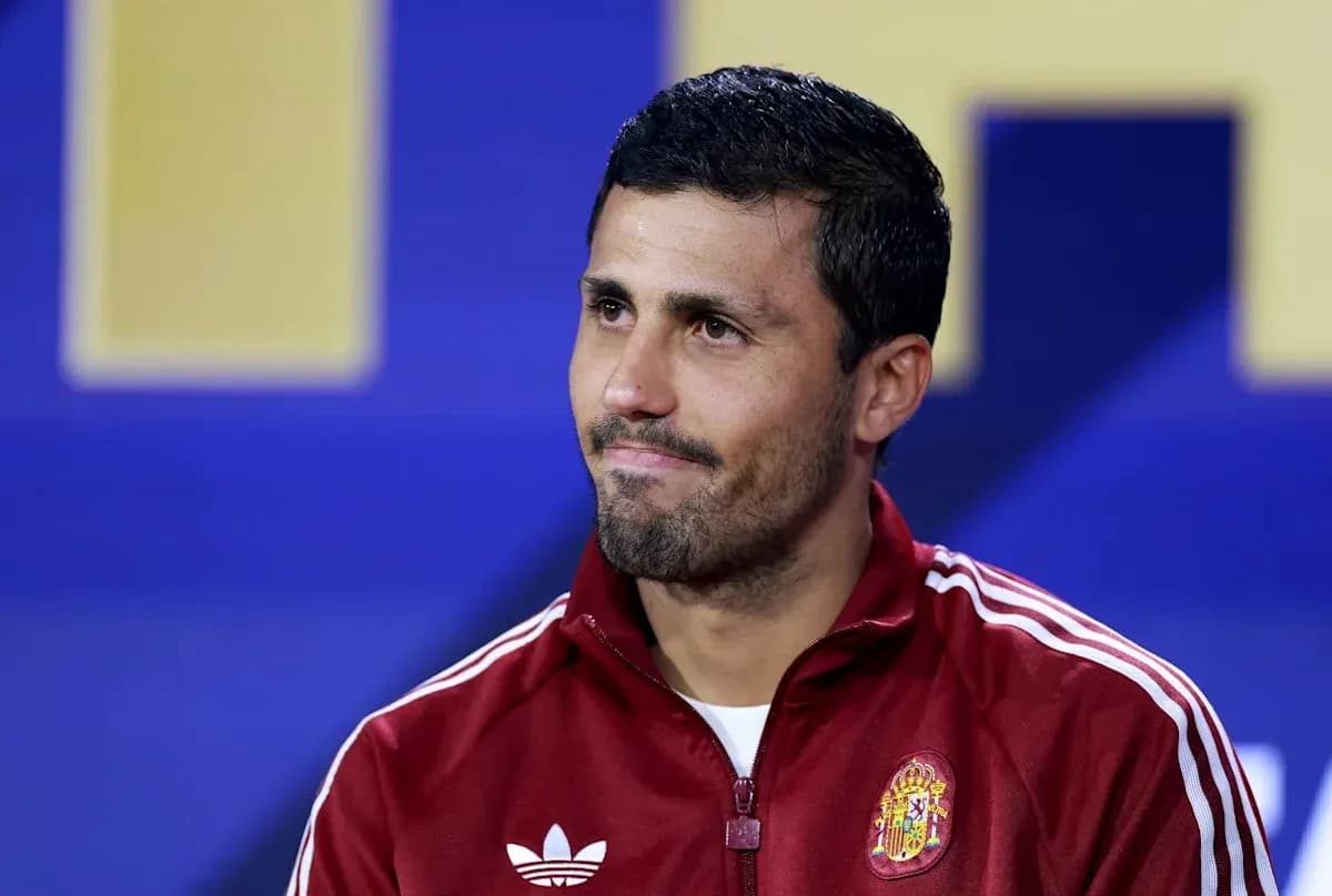 Player in Spain tracksuit at press conference