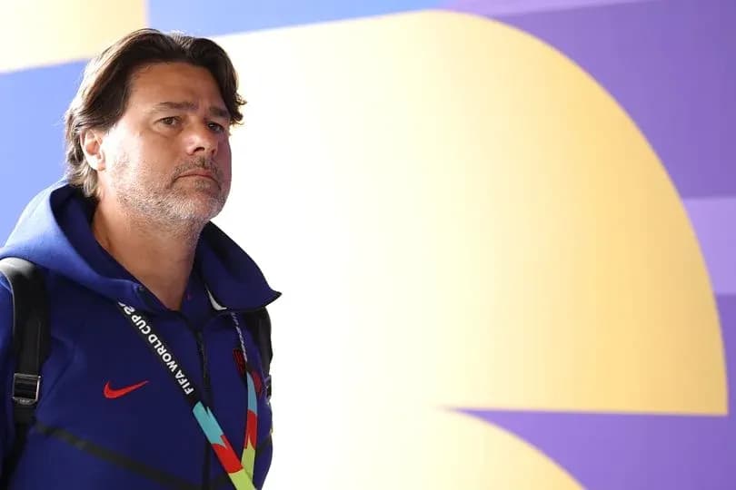 Coach walking in stadium with FIFA World Cup pass