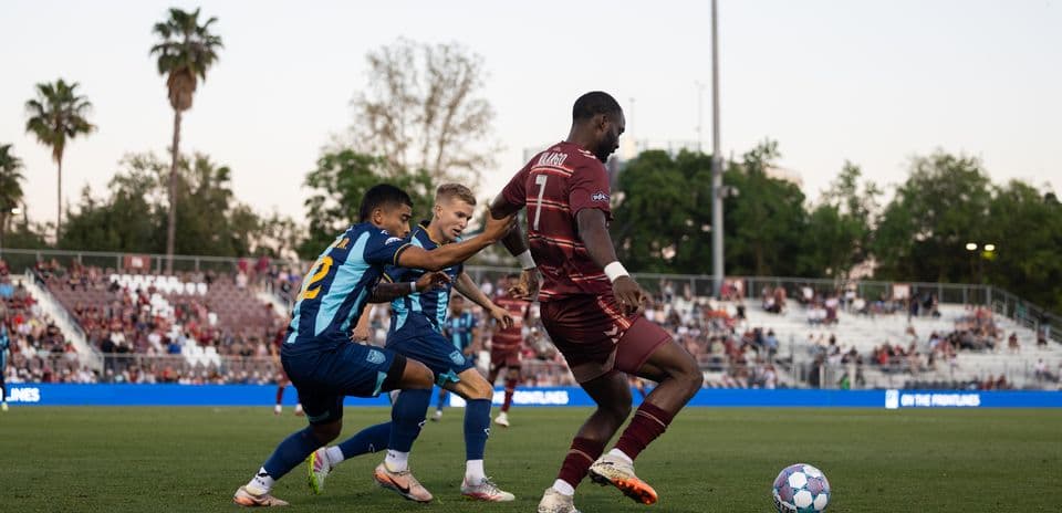 Sacramento Republic player dribbling past opponents