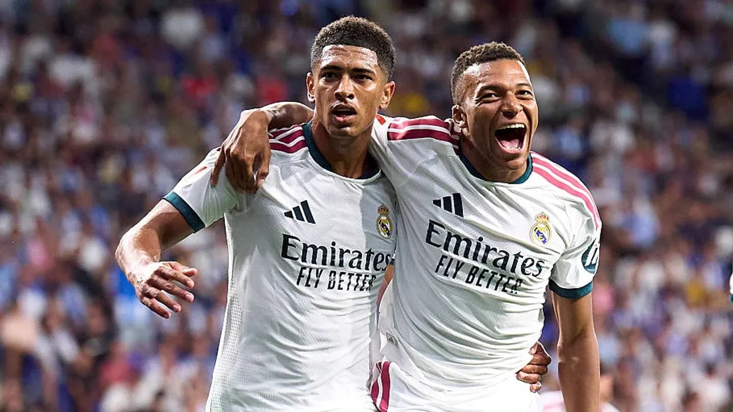 Two Real Madrid players celebrating a goal together
