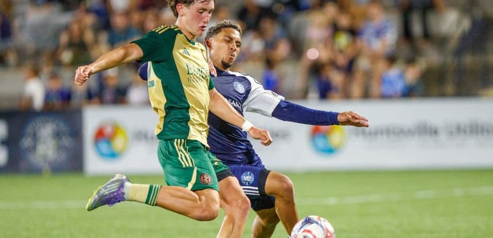 Players competing for the ball during match