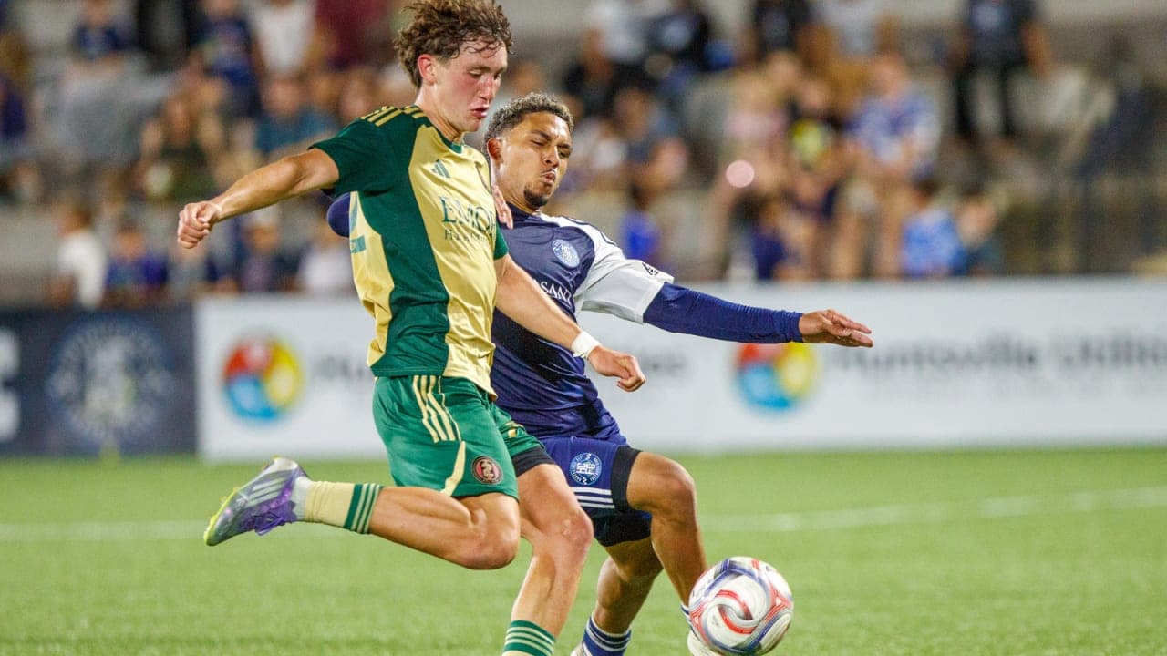 Players competing for the ball during match
