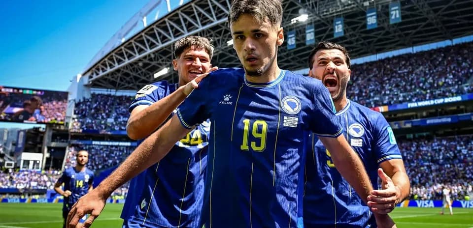 Bosnia players celebrating a goal on the field