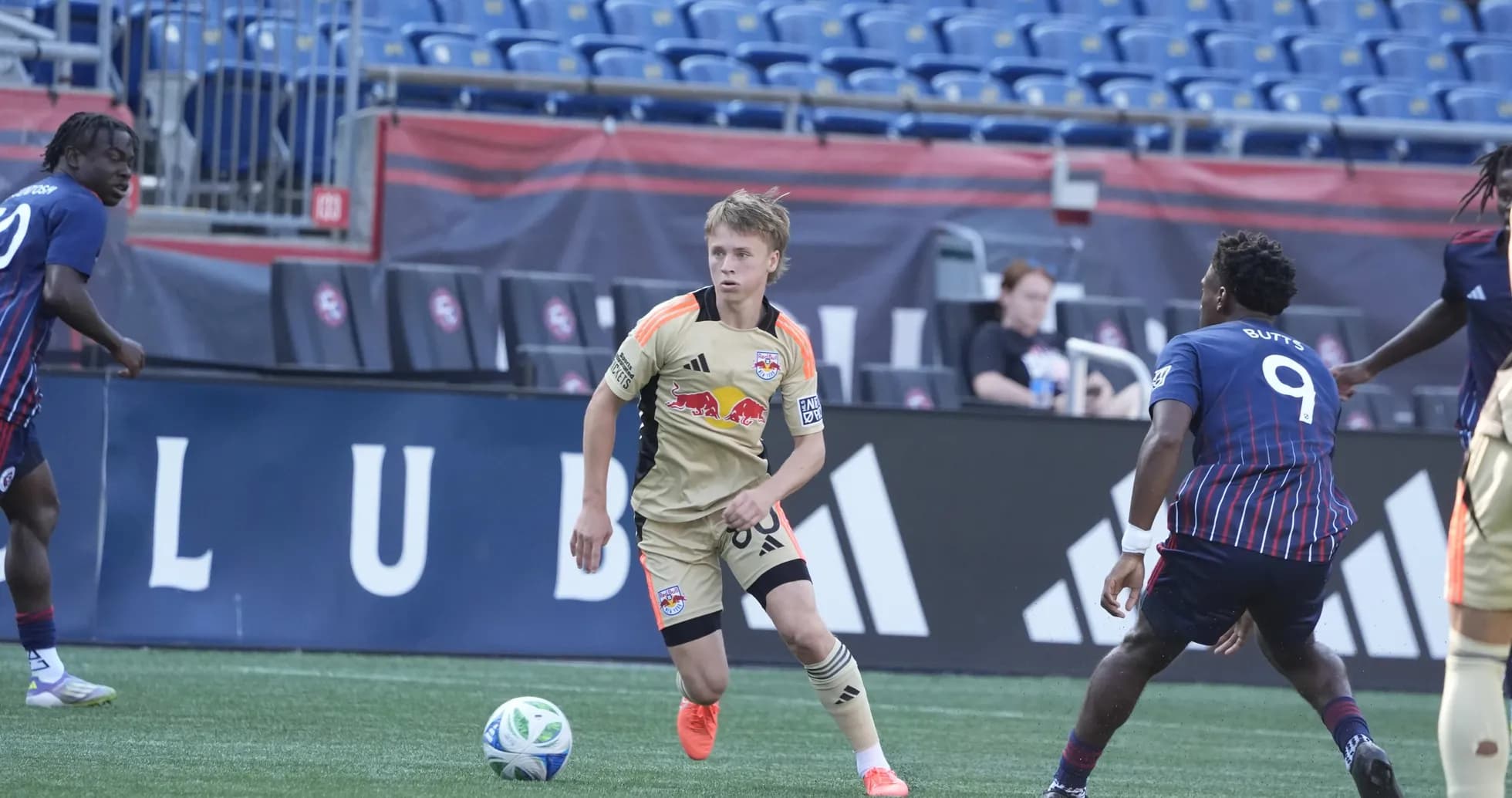 New York RB II player dribbling ball against opponents