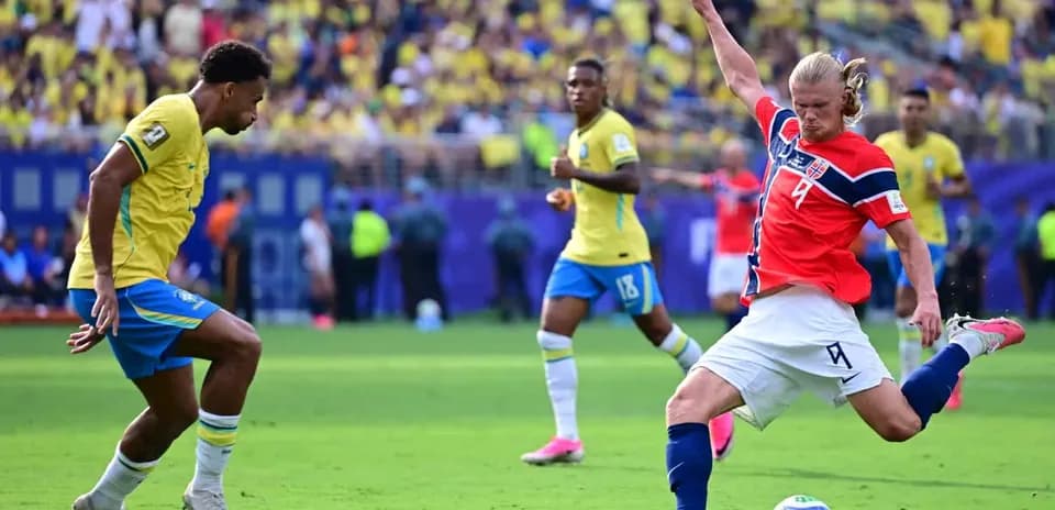 Player from Brazil and Norway competing for the ball