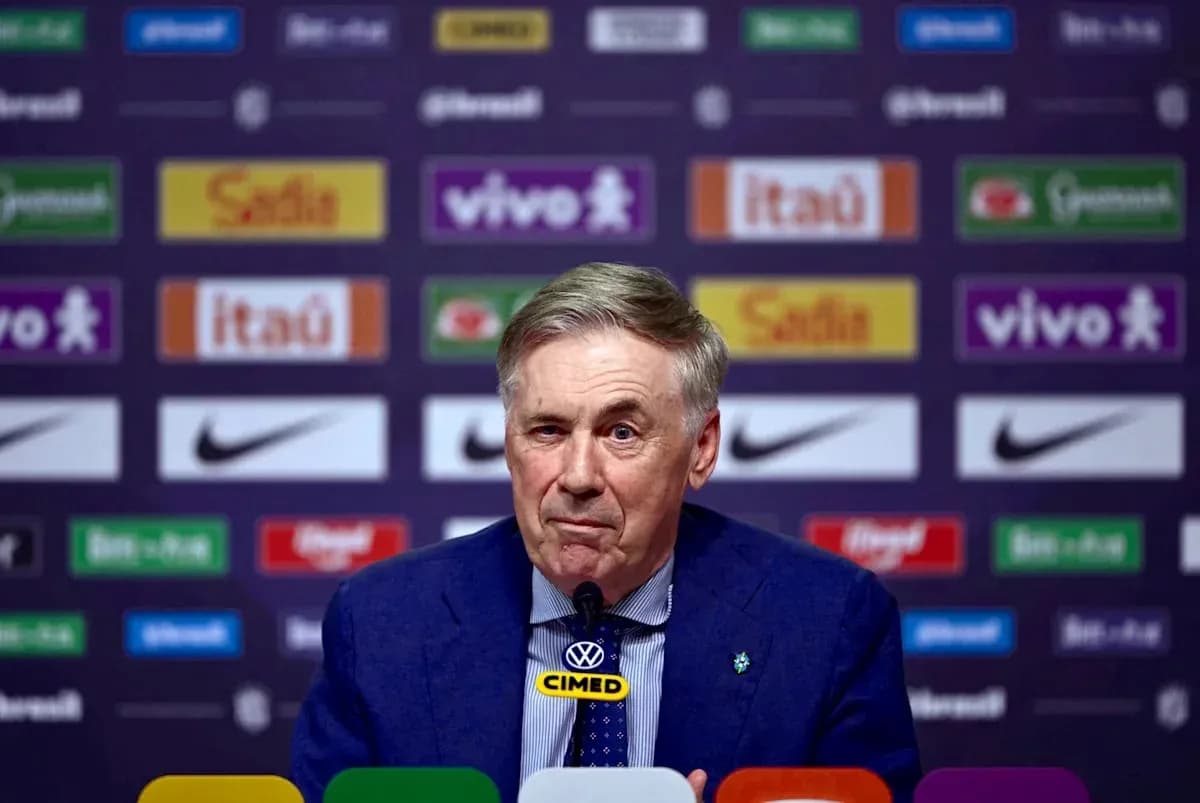 Manager speaking at press conference with logos behind