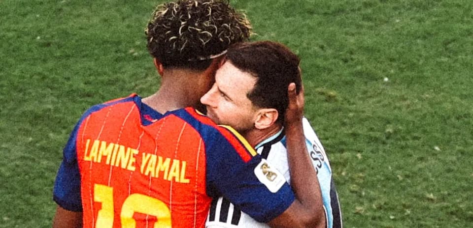 Two players embracing on the football field