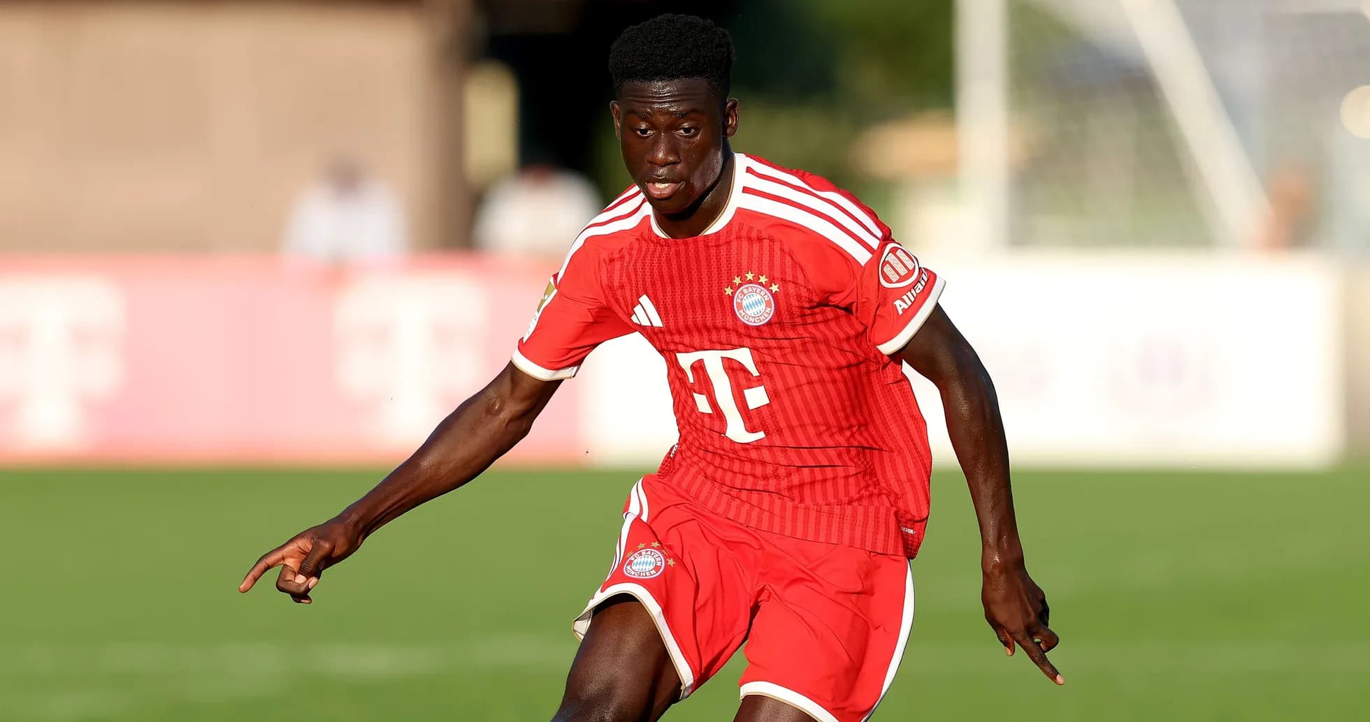 Player in red Bayern Munich kit during match Player in red Bayern Munich kit during match