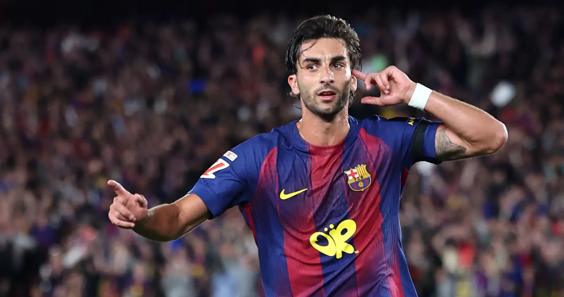 Player celebrating a goal at Camp Nou stadium Player celebrating a goal at Camp Nou stadium