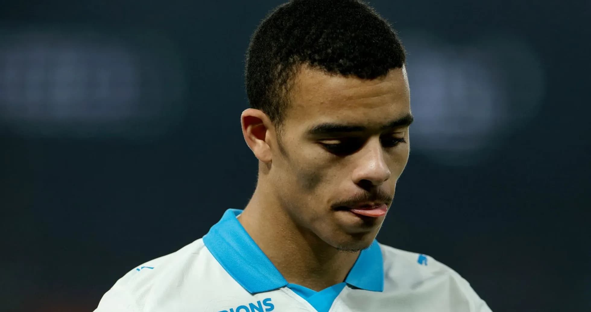 Player in Marseille jersey looking down during match Player in Marseille jersey looking down during match