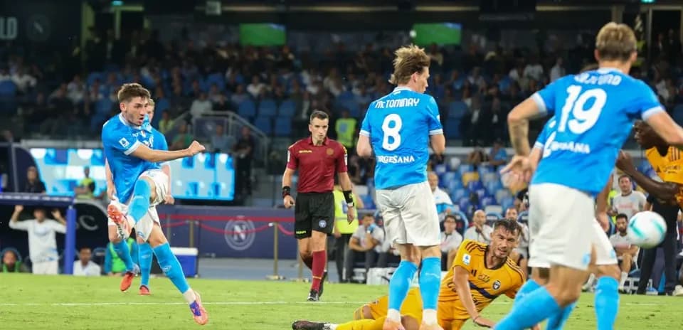 Napoli player striking the ball during match Napoli player striking the ball during match