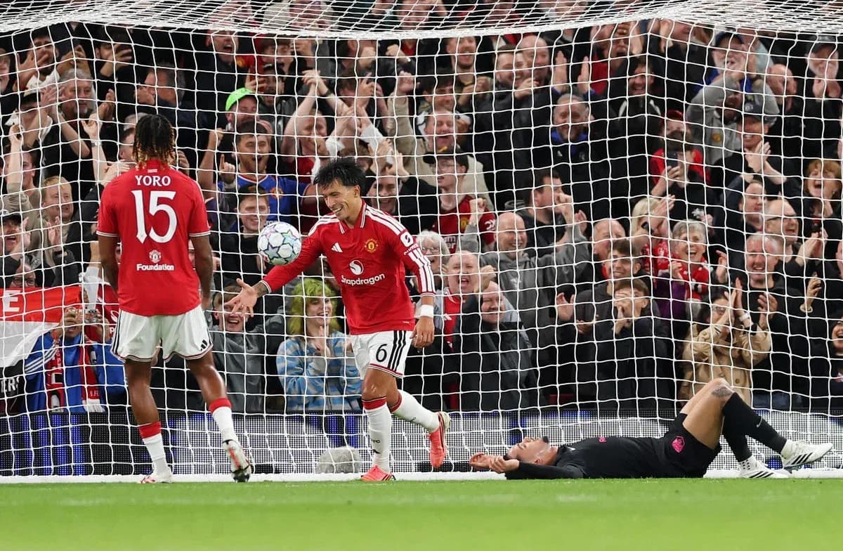 Manchester United players celebrating a goal in match Manchester United players celebrating a goal in match