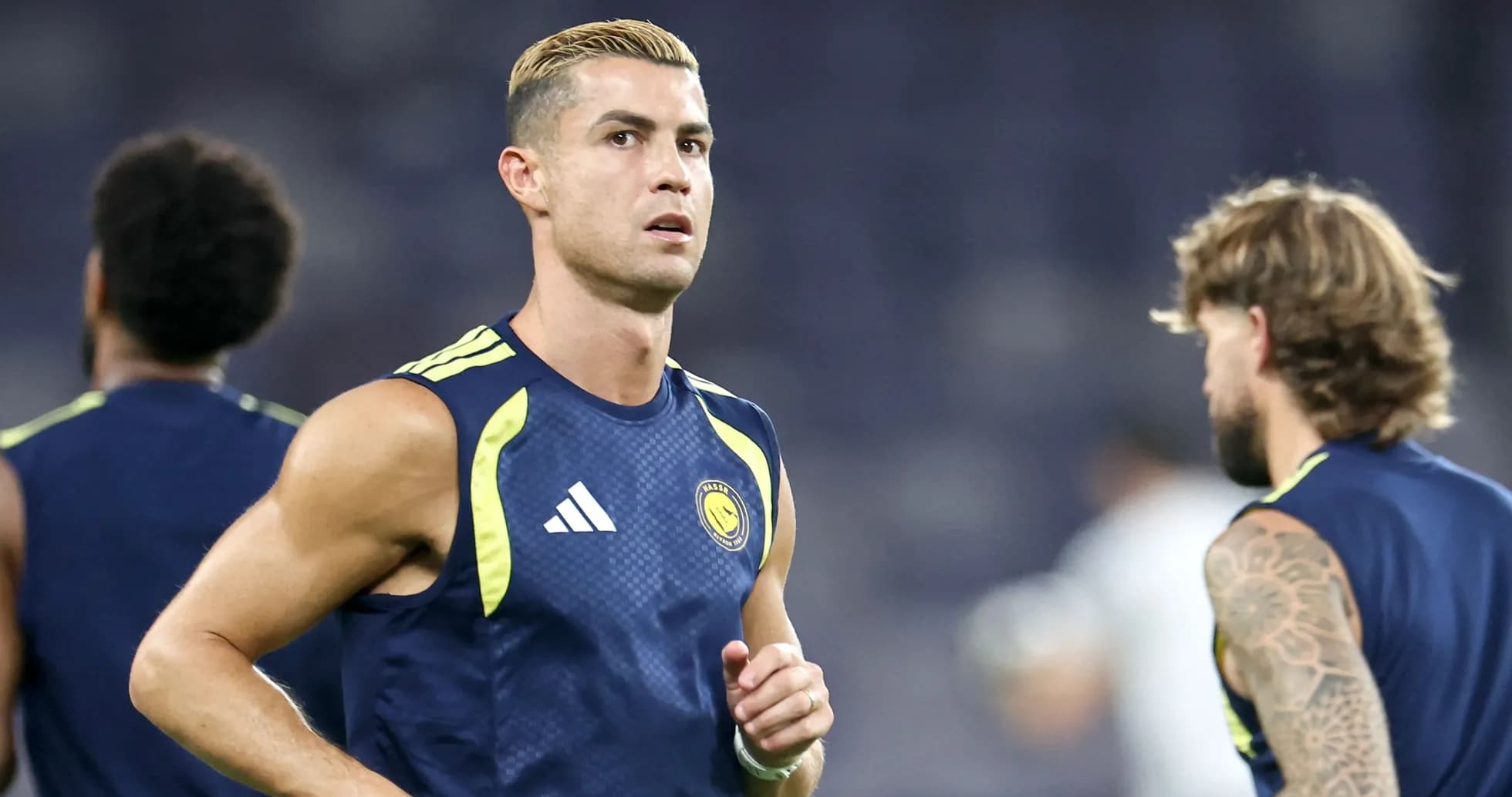 Player training on the pitch before a match Player training on the pitch before a match
