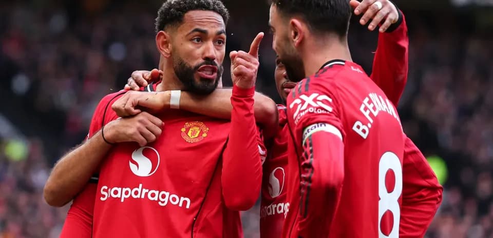 Manchester United players celebrating and discussing during match Manchester United players celebrating and discussing during match