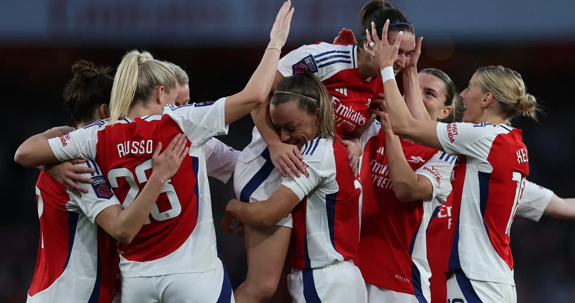 Arsenal W players celebrating a goal Arsenal W players celebrating a goal