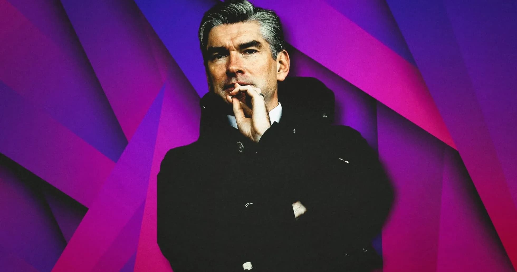 Man in a coat with a thoughtful expression Man in a coat with a thoughtful expression