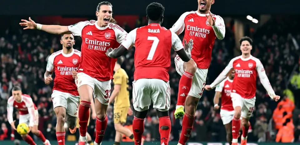 Arsenal players celebrating a goal during match Arsenal players celebrating a goal during match