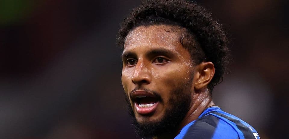 Player in blue kit during a match action Player in blue kit during a match action
