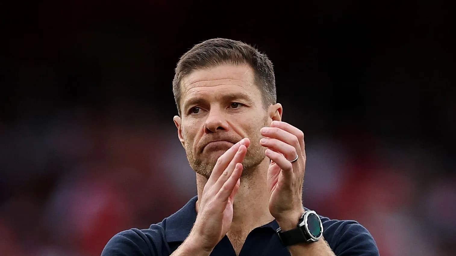 Coach applauding during a match or event Coach applauding during a match or event