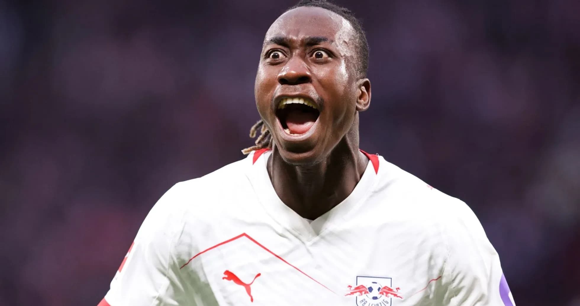 Player celebrating a goal passionately on the field Player celebrating a goal passionately on the field