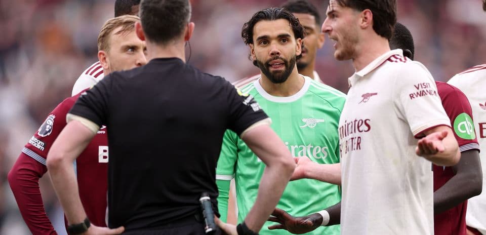 Players discussing with referee during match confrontation Players discussing with referee during match confrontation