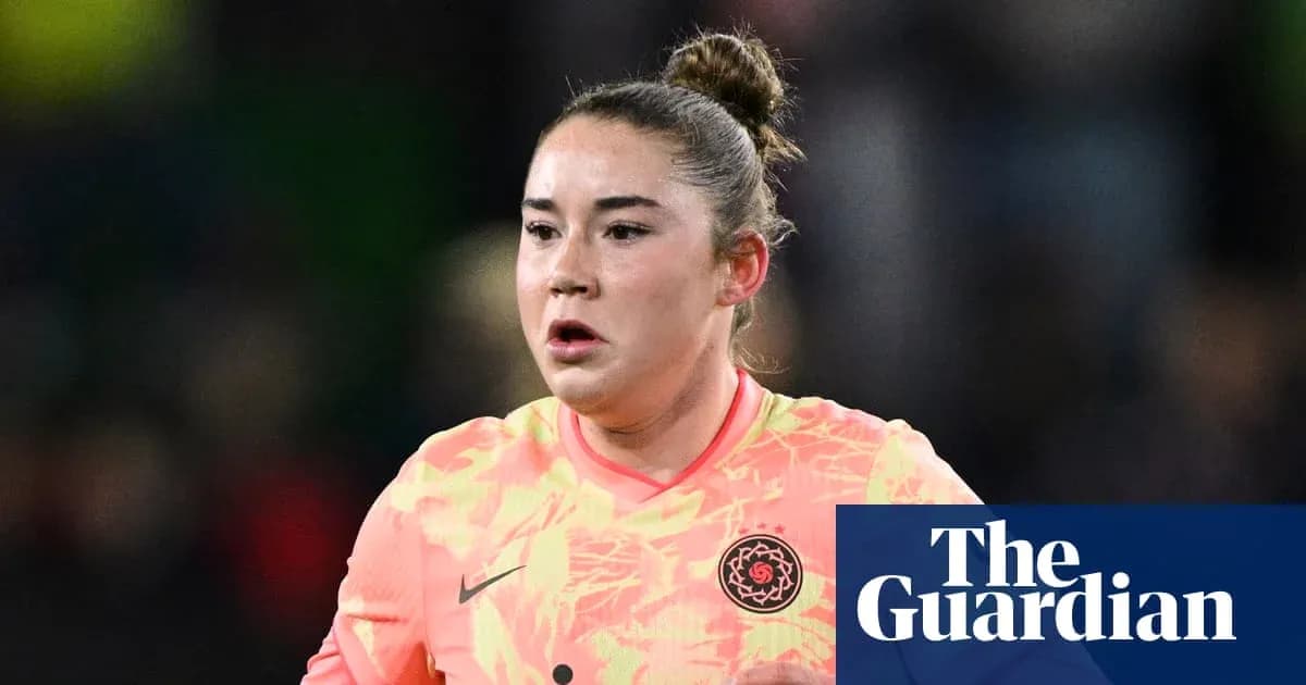 Goalkeeper in bright uniform during a match Goalkeeper in bright uniform during a match