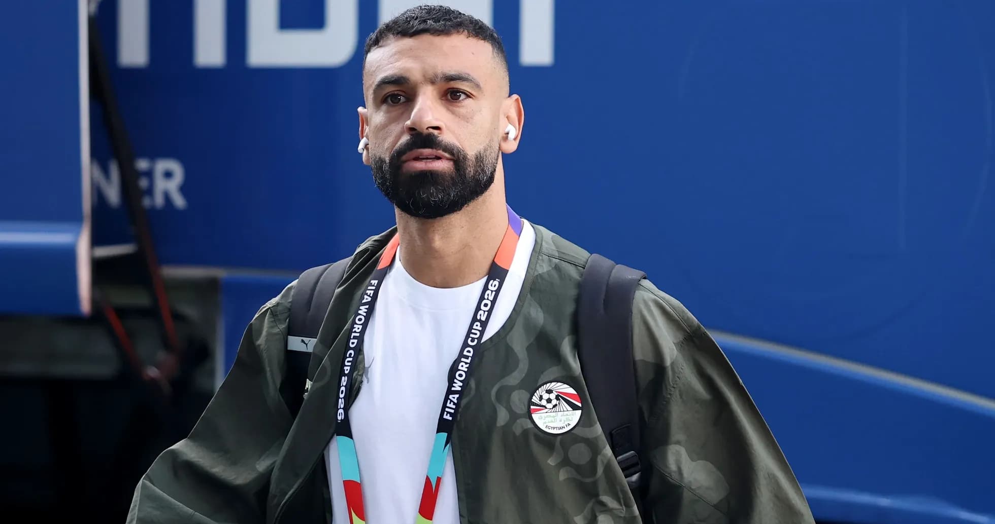 Player arriving at venue wearing headphones and jacket Player arriving at venue wearing headphones and jacket