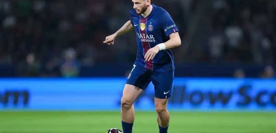 Player controlling the ball on the pitch Player controlling the ball on the pitch
