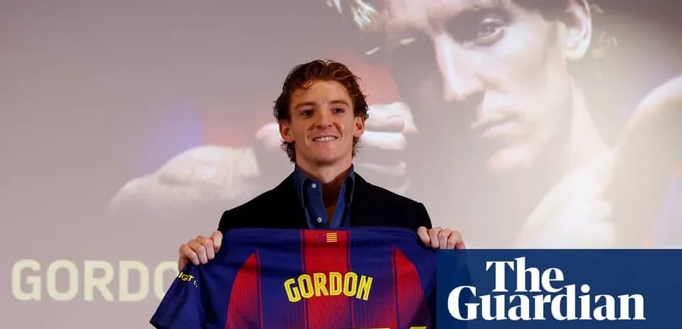 Player holding FC Barcelona jersey at presentation Player holding FC Barcelona jersey at presentation