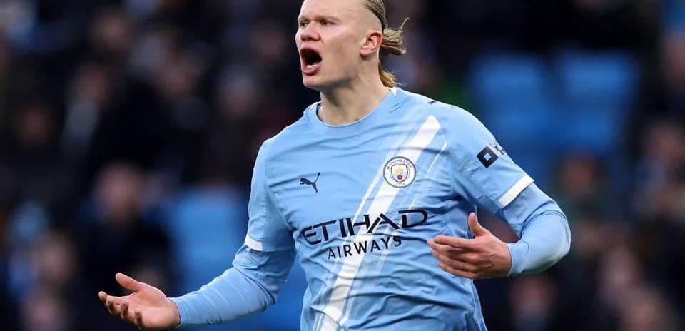 Player celebrating a goal in Manchester City kit Player celebrating a goal in Manchester City kit