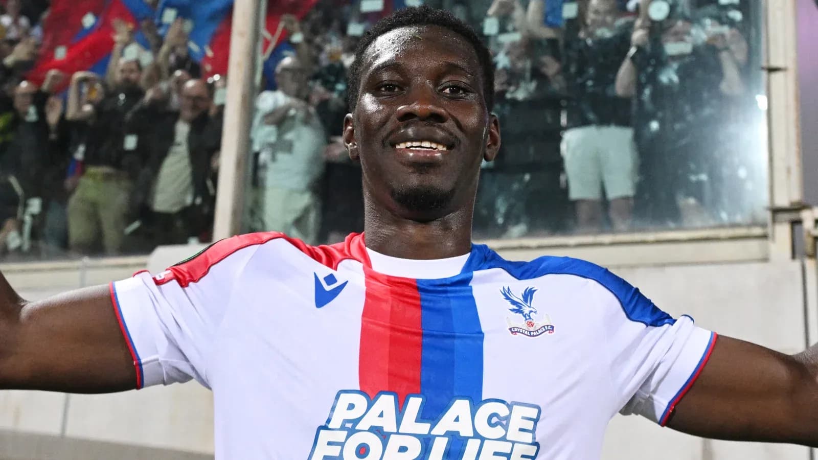Player celebrating in Crystal Palace jersey after match Player celebrating in Crystal Palace jersey after match