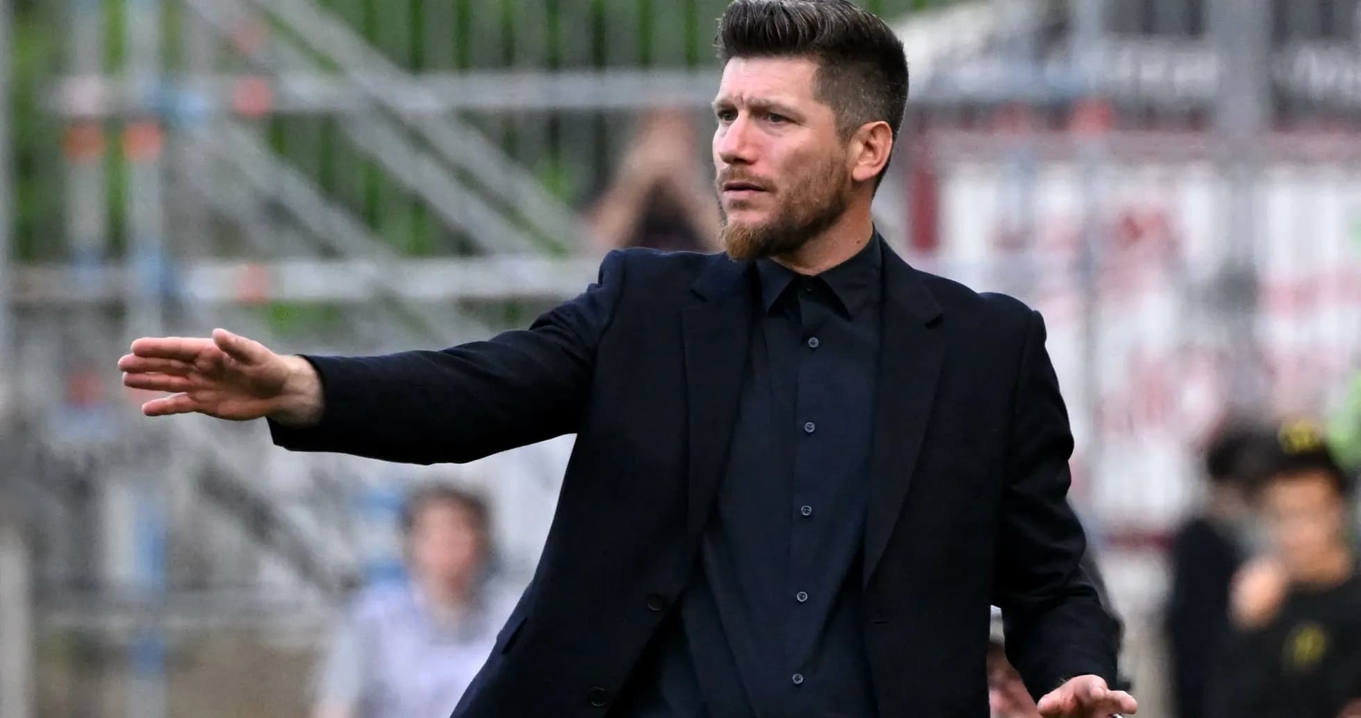 Coach gesturing during a football match Coach gesturing during a football match