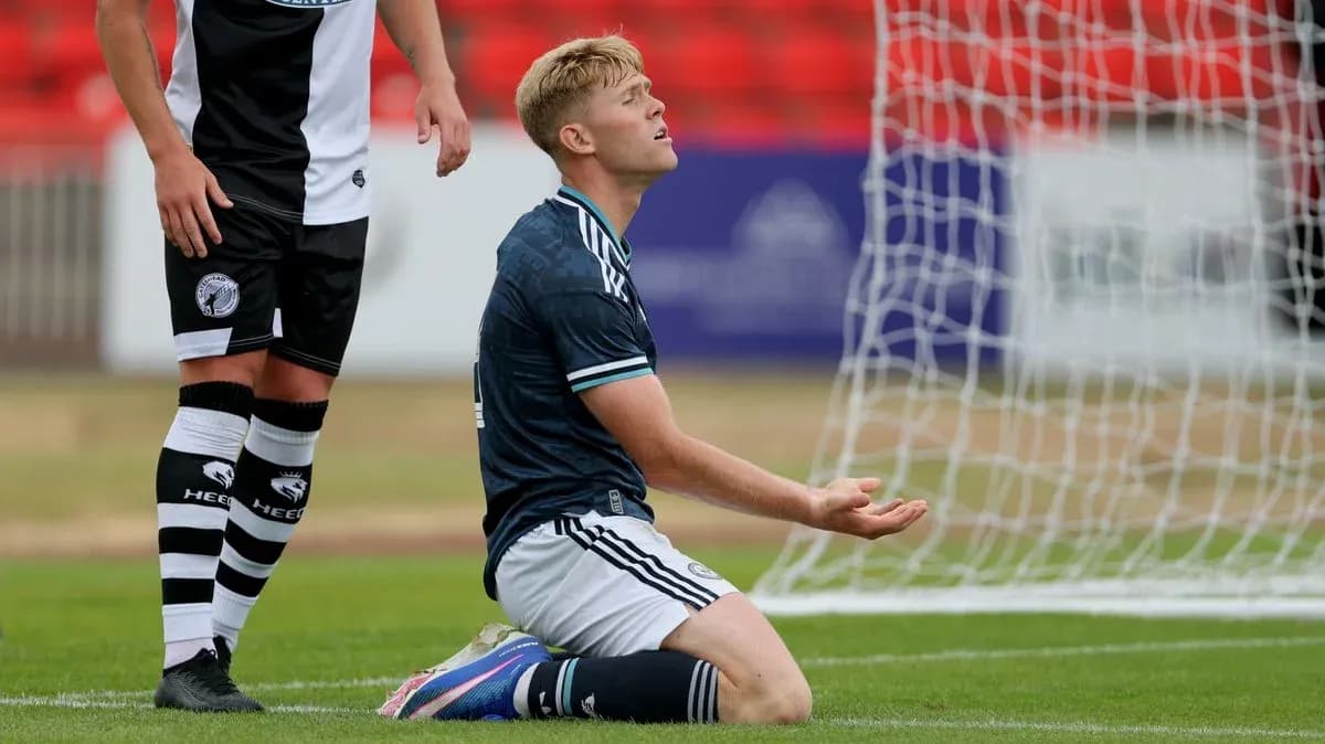 Player kneeling on pitch after missing a shot Player kneeling on pitch after missing a shot