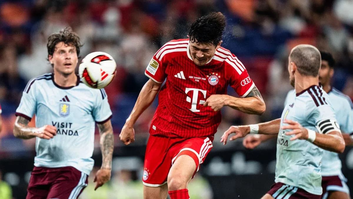 Player heading the ball during a competitive match Player heading the ball during a competitive match