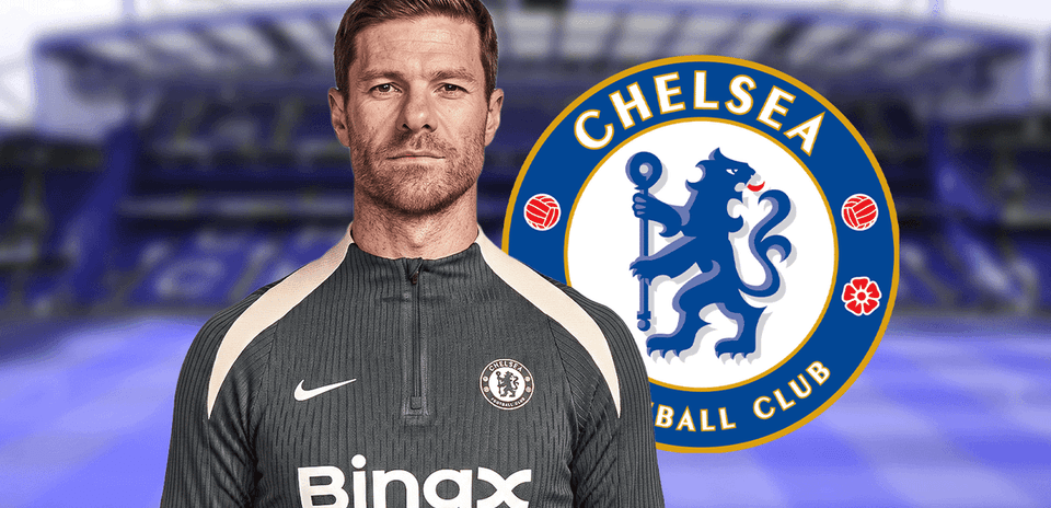 Coach in Chelsea FC training gear with club logo Coach in Chelsea FC training gear with club logo